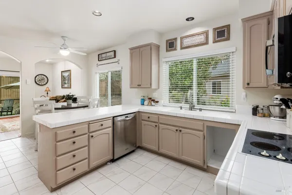 a kitchen with a sink stove and cabinets