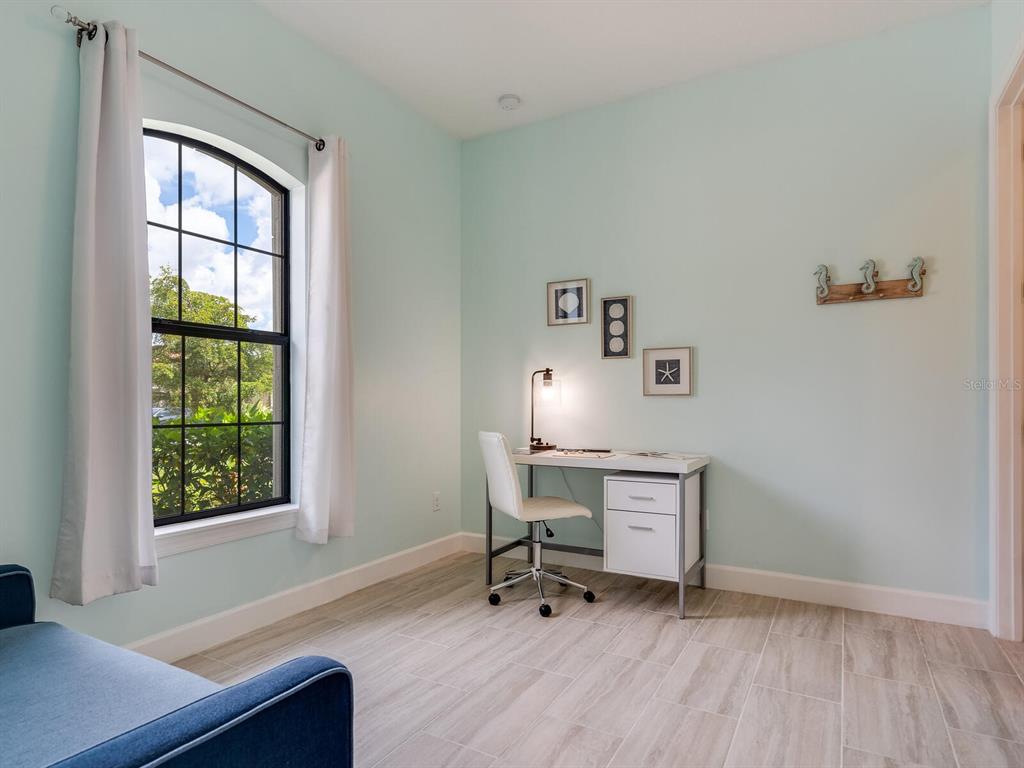 3929 Waypoint Avenue Osprey, FL 34229 - Photo 13 of 56 a view of a workspace with furniture and a window