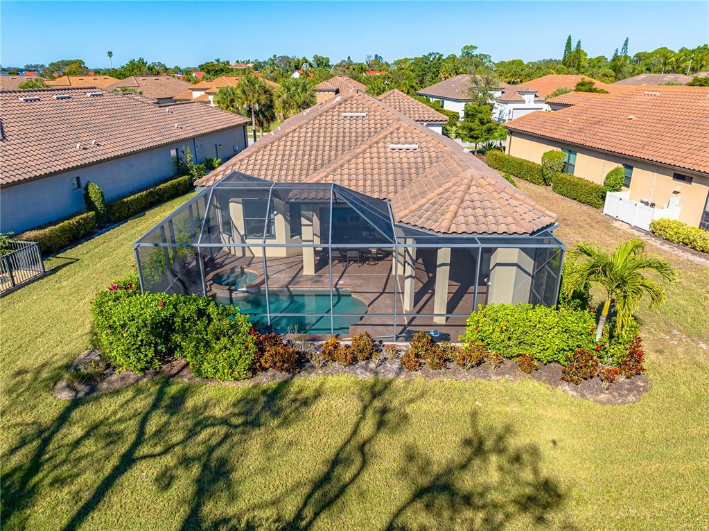 3929 Waypoint Avenue Osprey, FL 34229 - Photo 26 of 56 an aerial view of a house with a yard