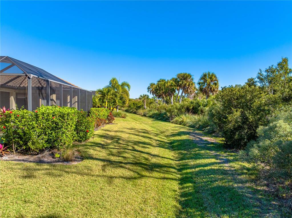 3929 Waypoint Avenue Osprey, FL 34229 - Photo 28 of 56 a swimming pool with trees in the background