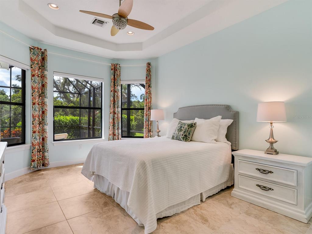 3929 Waypoint Avenue Osprey, FL 34229 - Photo 9 of 56 a bedroom with a large bed and a window