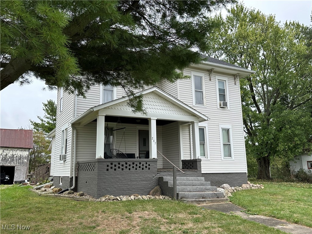 267 State Rte 511 Nova, OH 44859 - Photo 7 of 20 View of front of home with a porch and a front lawn