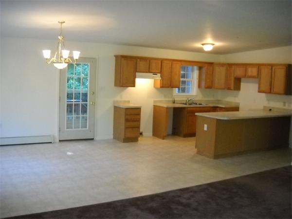 180 Popple Camp Road Petersham, MA 01366 - Photo 11 of 30 a kitchen with kitchen island a sink stainless steel appliances and cabinets