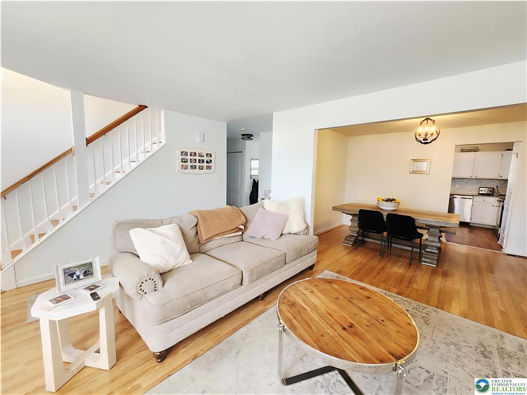 237 Ridings Circle Macungie, PA 18062 - Photo 70 of 70 Rich hardwood flooring anchors this inviting open floorplan connecting the main living spaces.