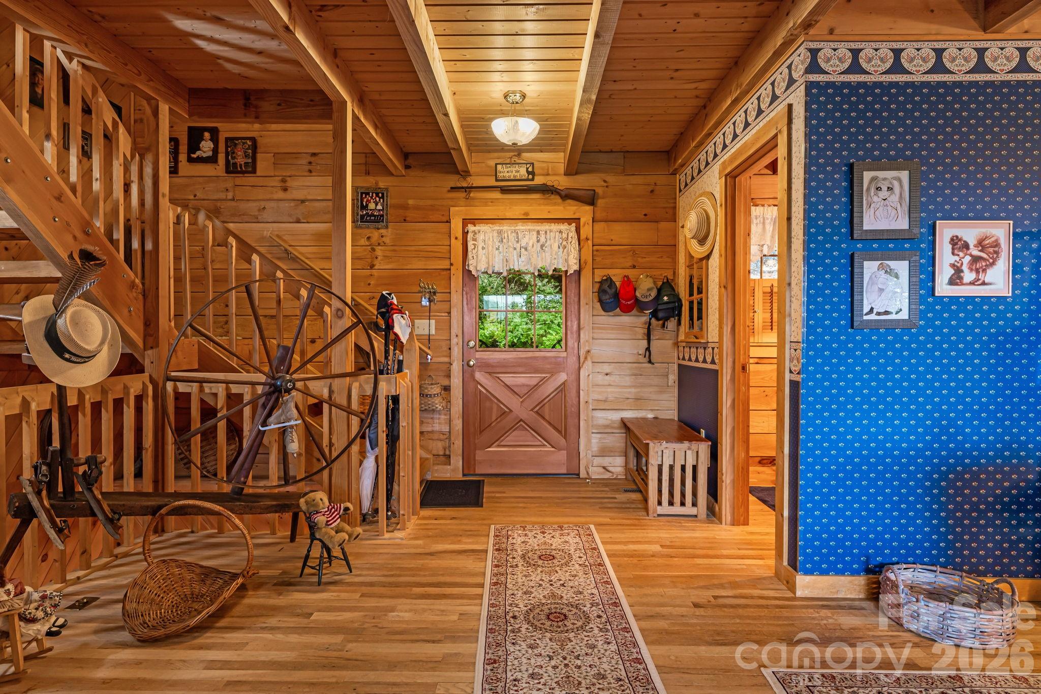 215 Goldenleaf Road Mars Hill, NC 28754 - Photo 11 of 47 a view of a entryway with wooden walls