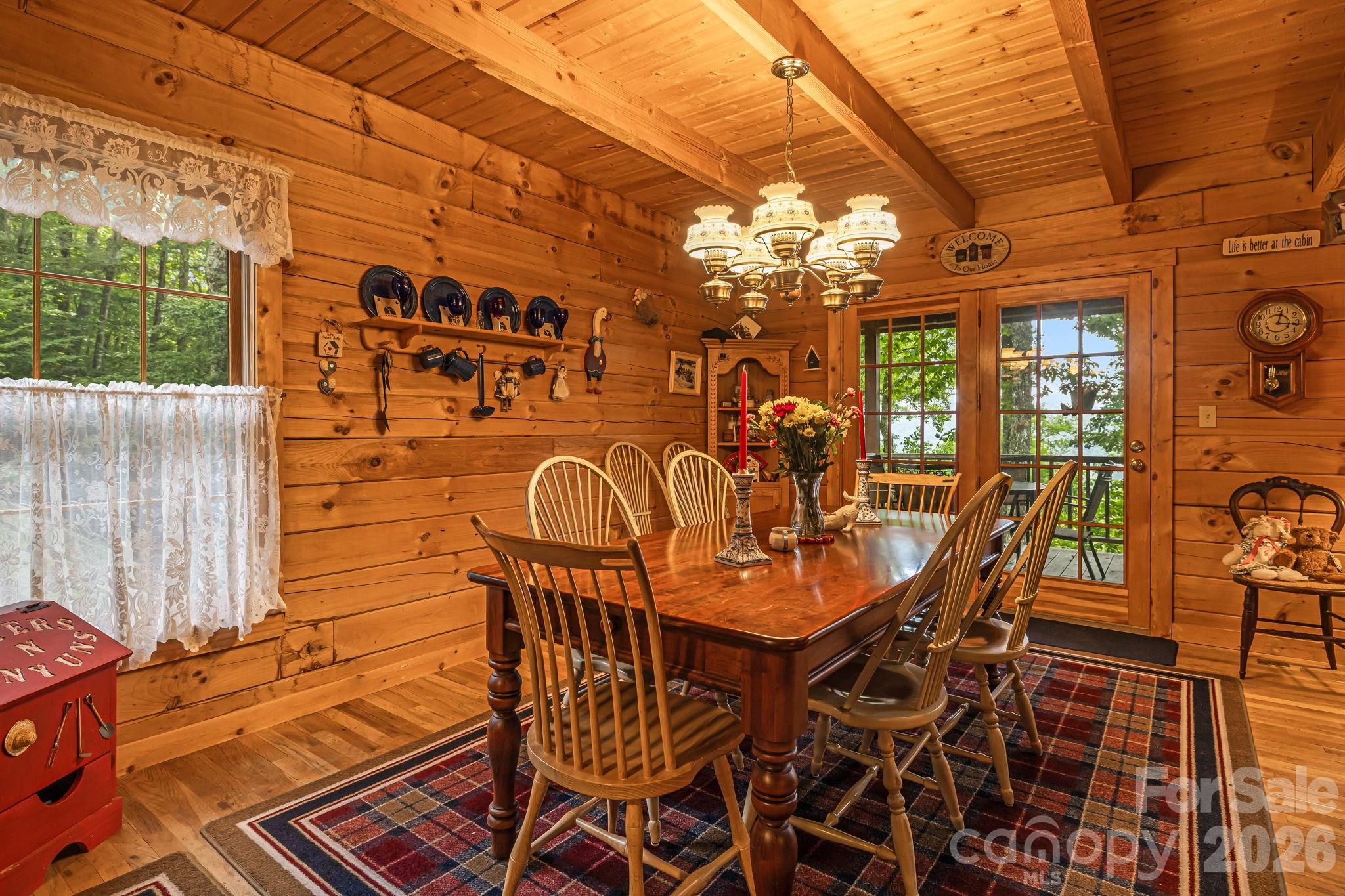 215 Goldenleaf Road Mars Hill, NC 28754 - Photo 14 of 47 a view of a patio with a table and chairs
