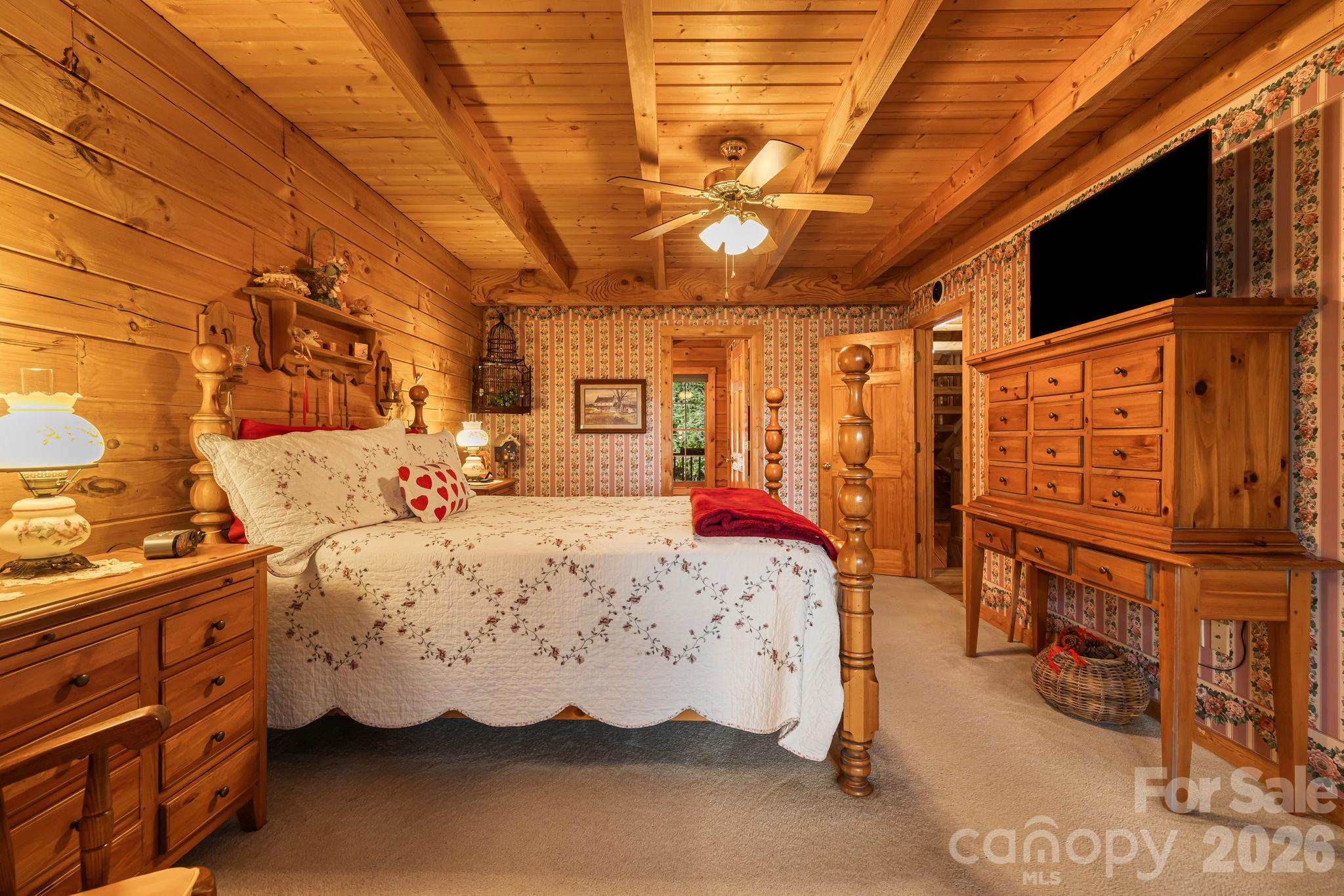 215 Goldenleaf Road Mars Hill, NC 28754 - Photo 19 of 47 a bed room with a bed and a television