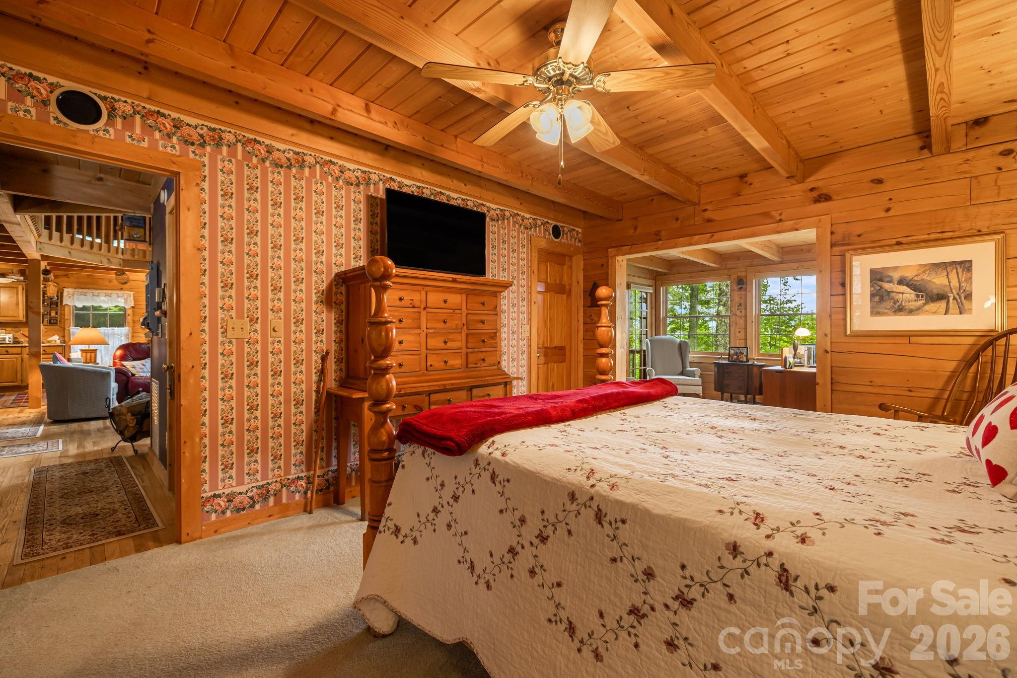 215 Goldenleaf Road Mars Hill, NC 28754 - Photo 20 of 47 a bed sitting in a bedroom next to a window