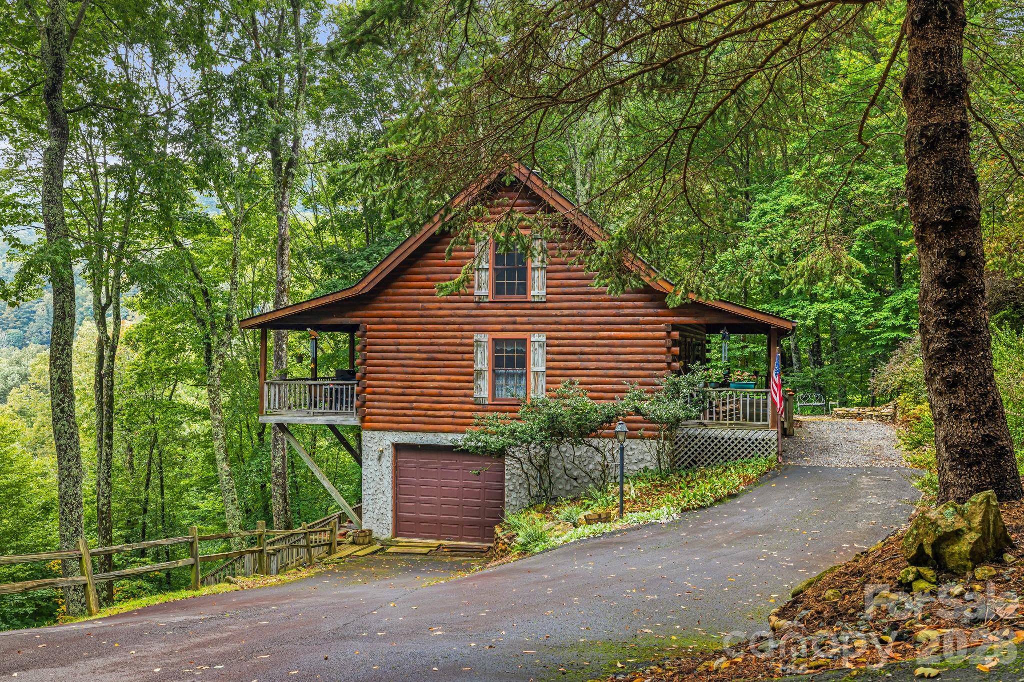 215 Goldenleaf Road Mars Hill, NC 28754 - Photo 3 of 47 a view of a house with backyard and garden