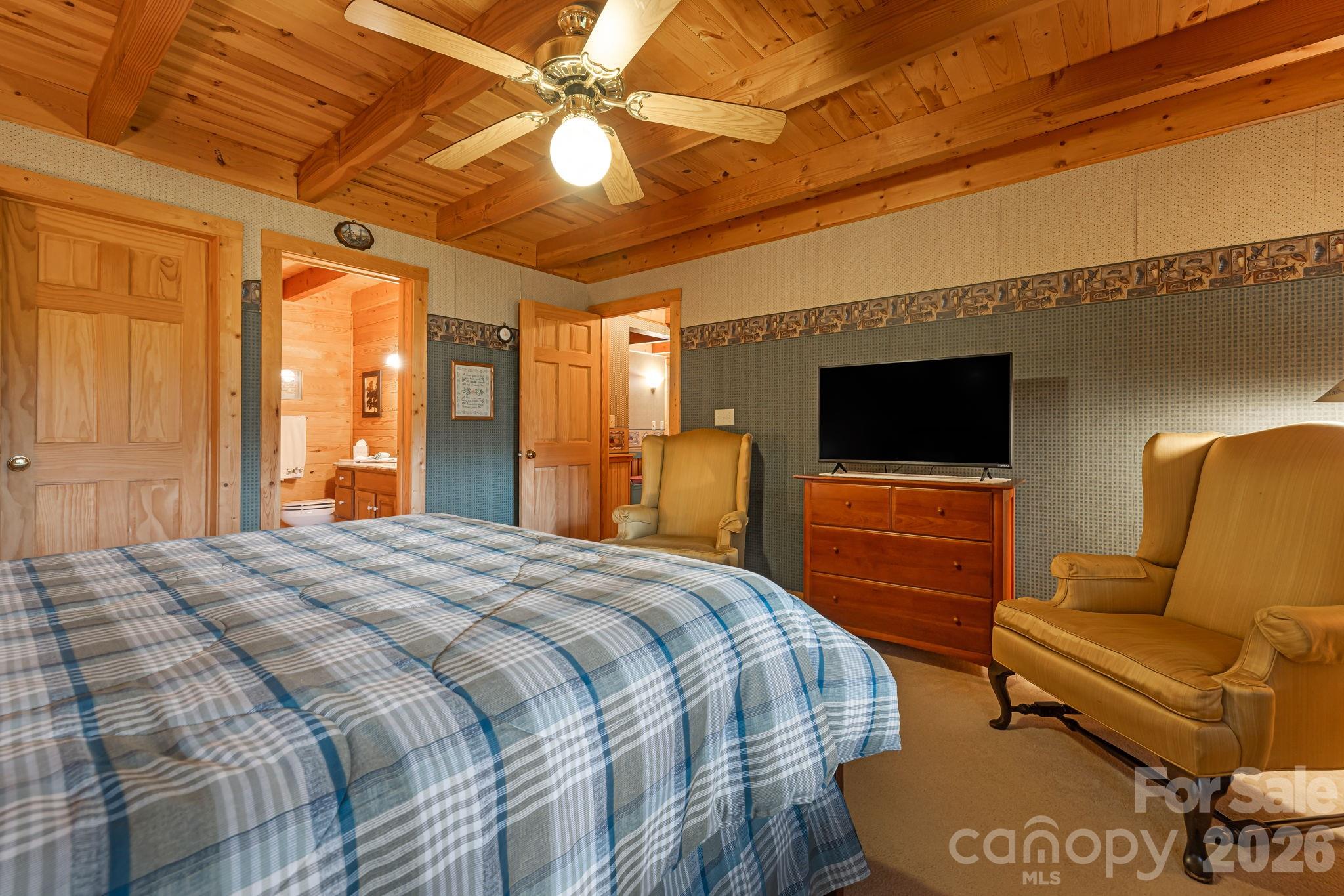 215 Goldenleaf Road Mars Hill, NC 28754 - Photo 32 of 47 a bedroom with a bed and a television