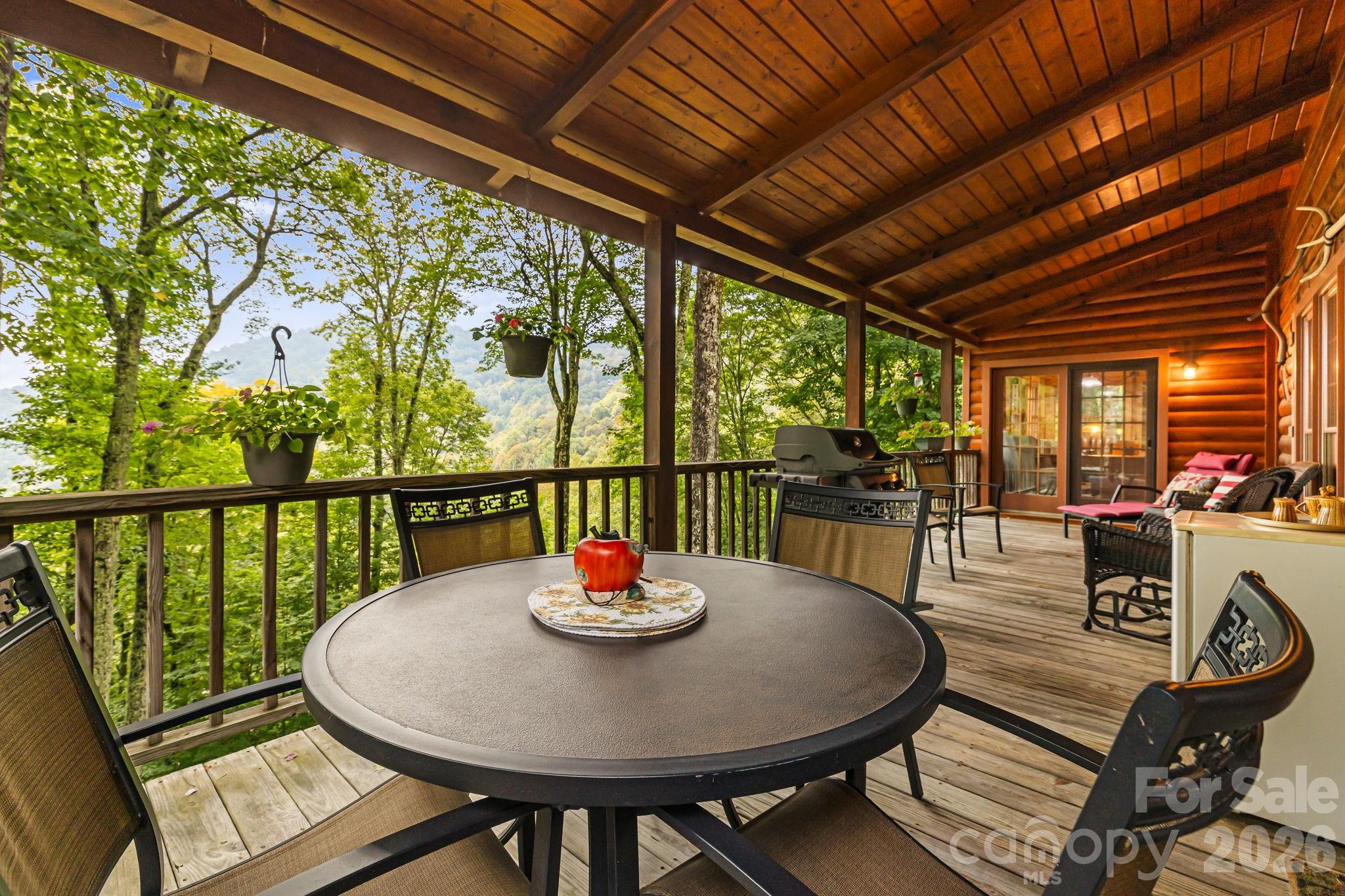215 Goldenleaf Road Mars Hill, NC 28754 - Photo 35 of 47 a view of a dining room with furniture window and outside view