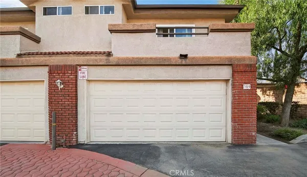 front view of a house with a bench