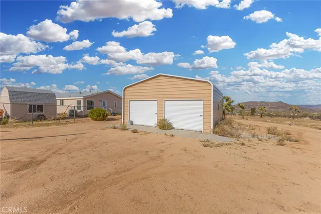 a view of a yard with an outdoor space