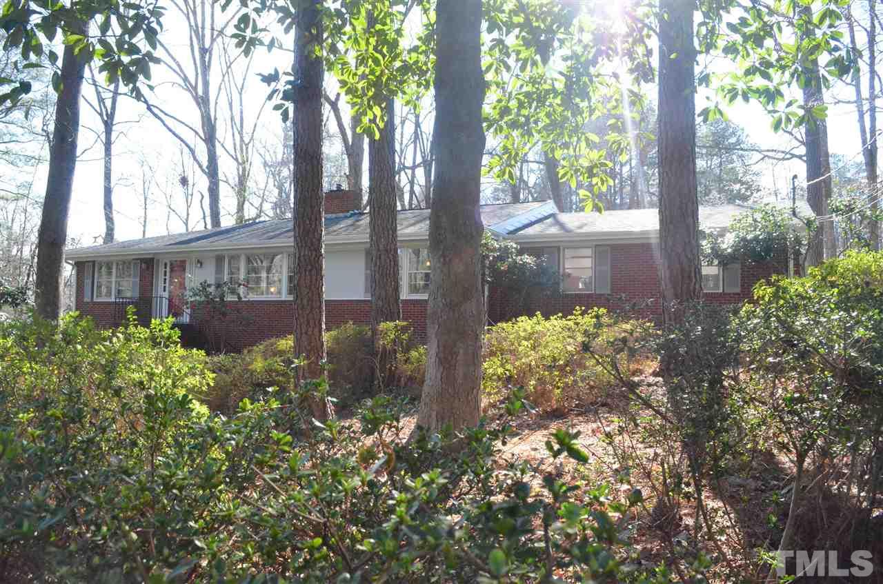 5311 Alpine Drive Raleigh, NC 27609 - Photo 2 of 25 a view of a house with a yard and garden