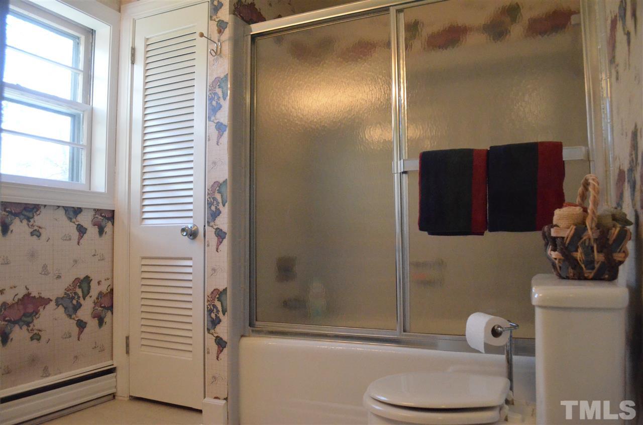 5311 Alpine Drive Raleigh, NC 27609 - Photo 18 of 25 a bathroom with a toilet and a shower