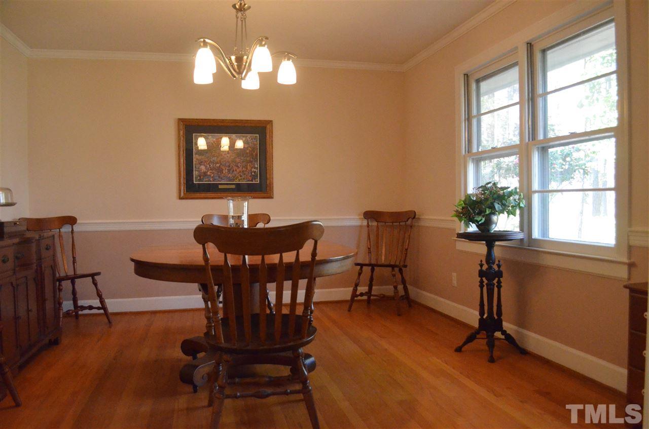 5311 Alpine Drive Raleigh, NC 27609 - Photo 6 of 25 a view of a dining room with furniture window and wooden floor