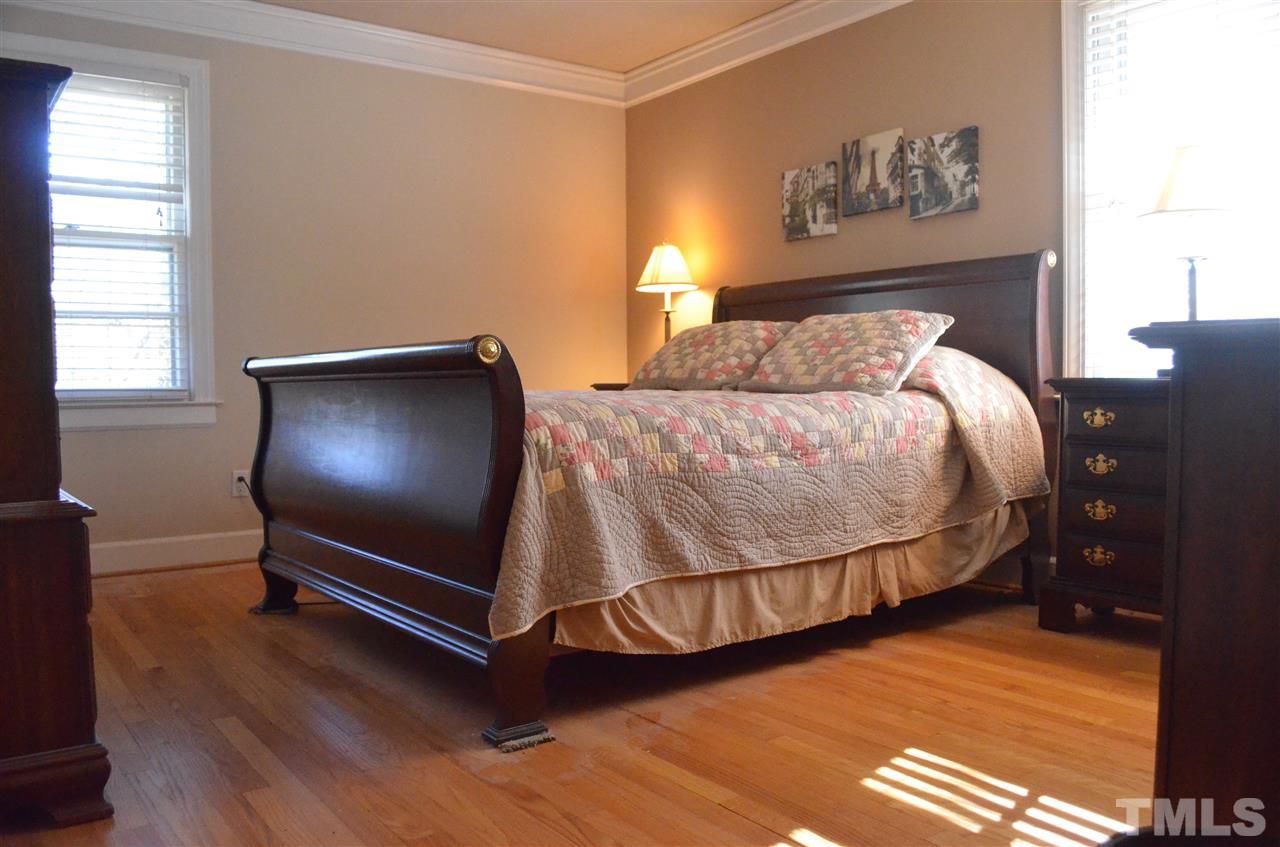 5311 Alpine Drive Raleigh, NC 27609 - Photo 9 of 25 a bedroom with a bed and window
