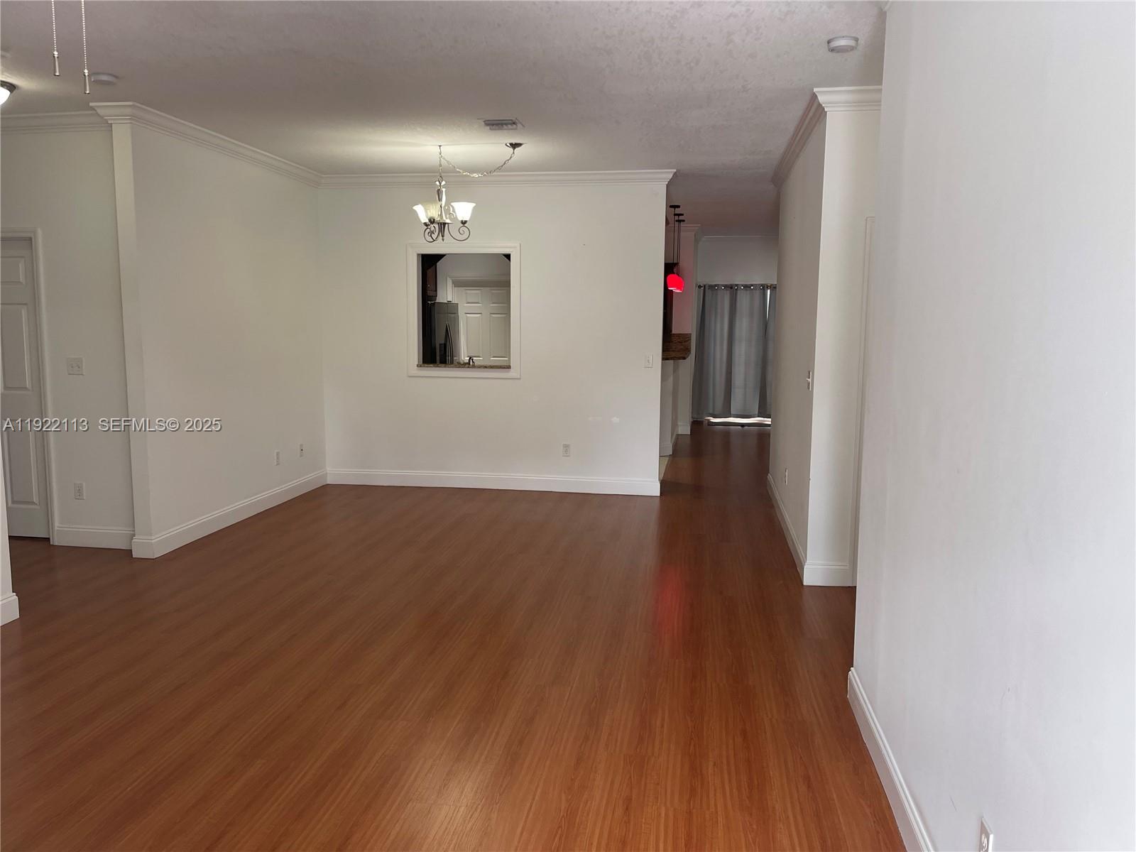 425 Northwest 135th Street North Miami, FL 33168 - Photo 2 of 12 wooden floor in an empty room with wooden floor