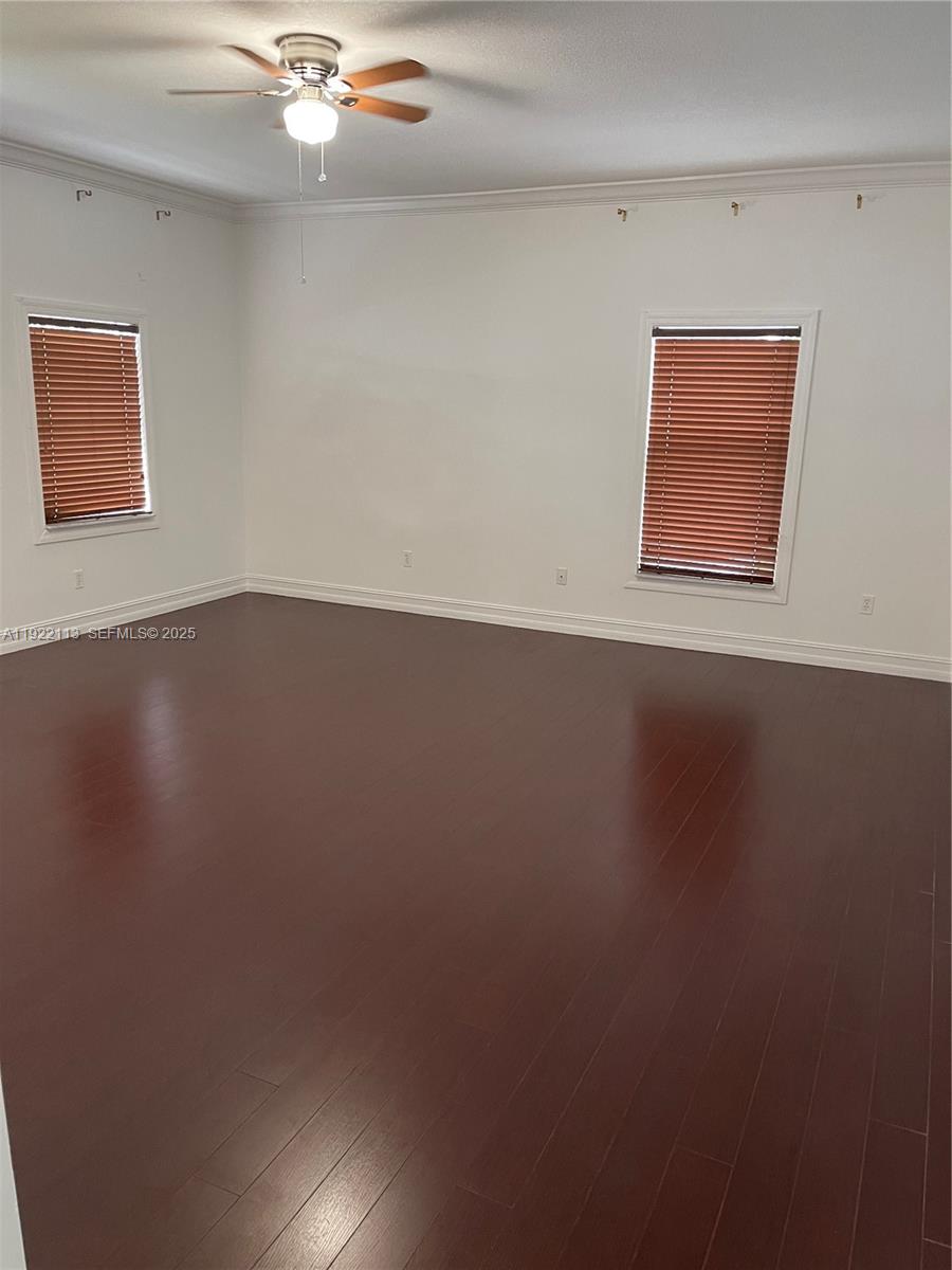 425 Northwest 135th Street North Miami, FL 33168 - Photo 5 of 12 a view of a room with wooden floor and window