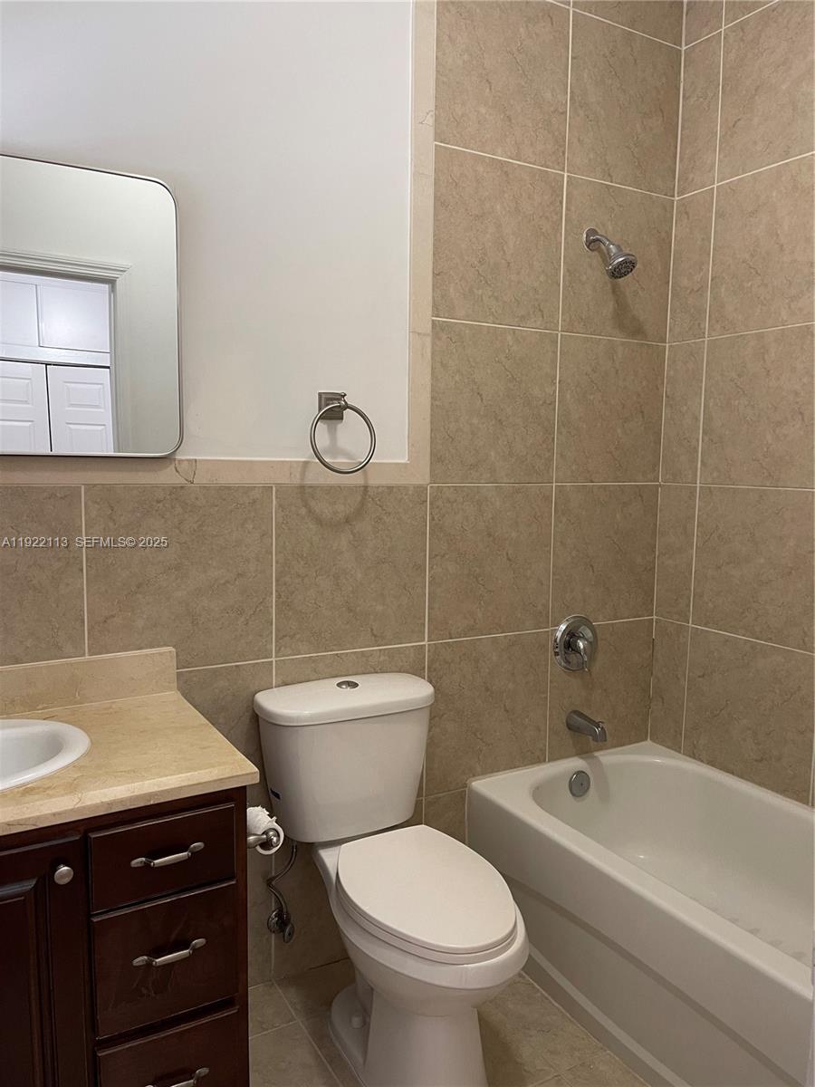 425 Northwest 135th Street North Miami, FL 33168 - Photo 9 of 12 a bathroom with a sink a toilet and shower