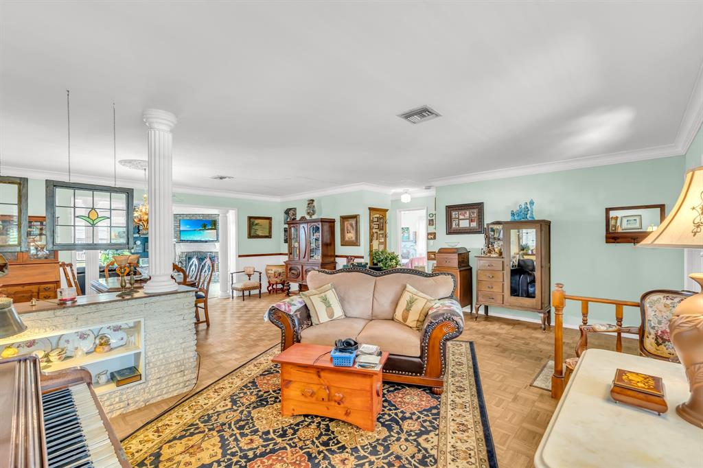 1931 Northeast 27th Street Lighthouse Point, FL 33064 - Photo 13 of 28 a living room with furniture and wooden floor