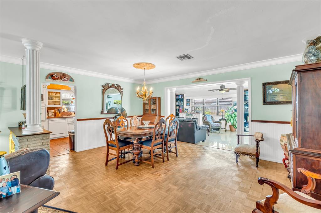 1931 Northeast 27th Street Lighthouse Point, FL 33064 - Photo 14 of 28 a dining room with furniture and wooden floor