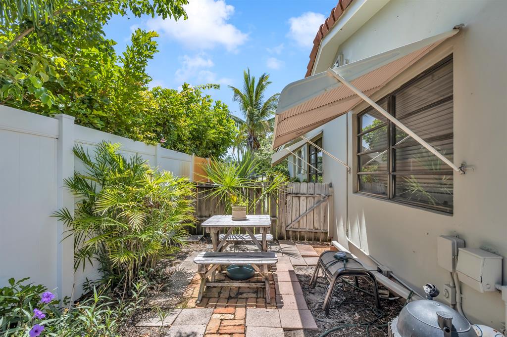 1931 Northeast 27th Street Lighthouse Point, FL 33064 - Photo 19 of 28 a view of yard with outdoor seating and green space