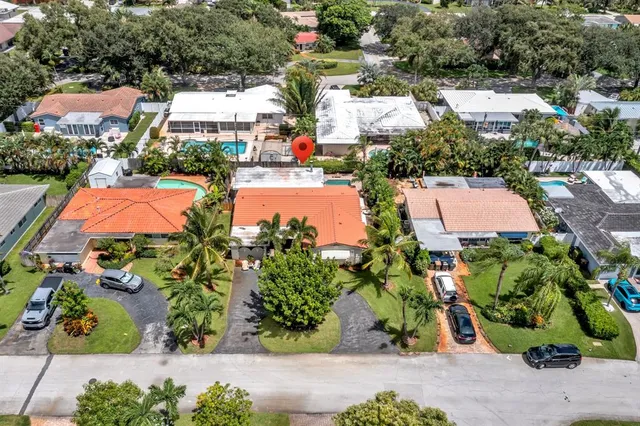 an aerial view of residential houses with outdoor space