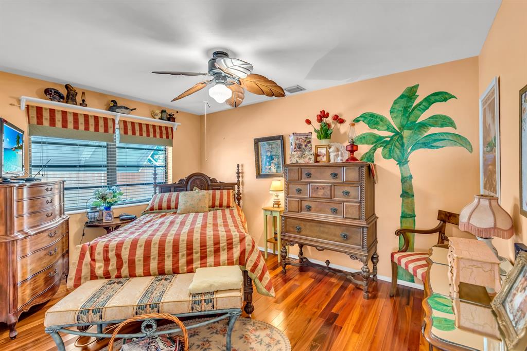 1931 Northeast 27th Street Lighthouse Point, FL 33064 - Photo 27 of 28 a bedroom with furniture and a potted plant
