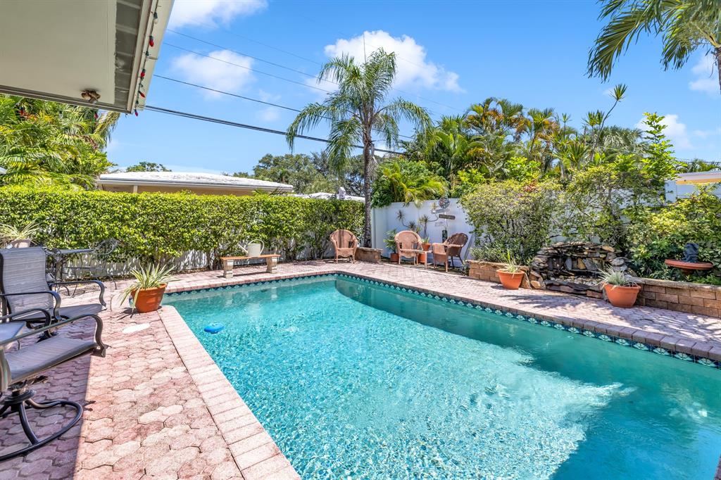 1931 Northeast 27th Street Lighthouse Point, FL 33064 - Photo 3 of 28 a view of swimming pool with a patio