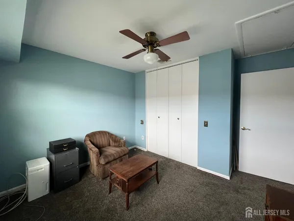 a bathroom with a granite countertop sink a mirror and vanity