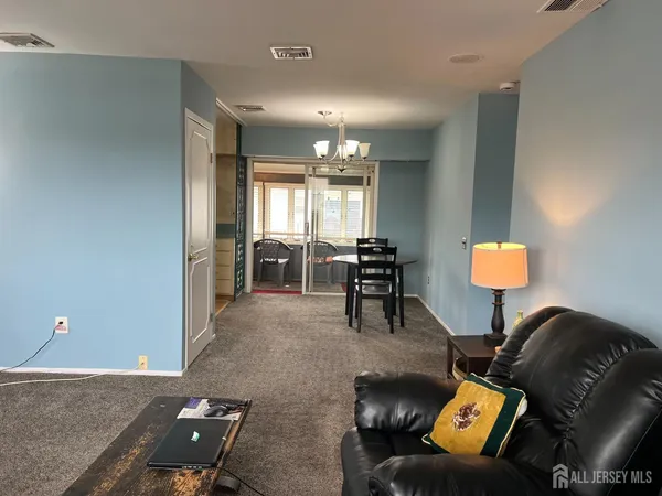 a kitchen with a refrigerator and a stove top oven