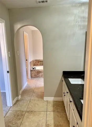 a view of a bathroom from the hallway