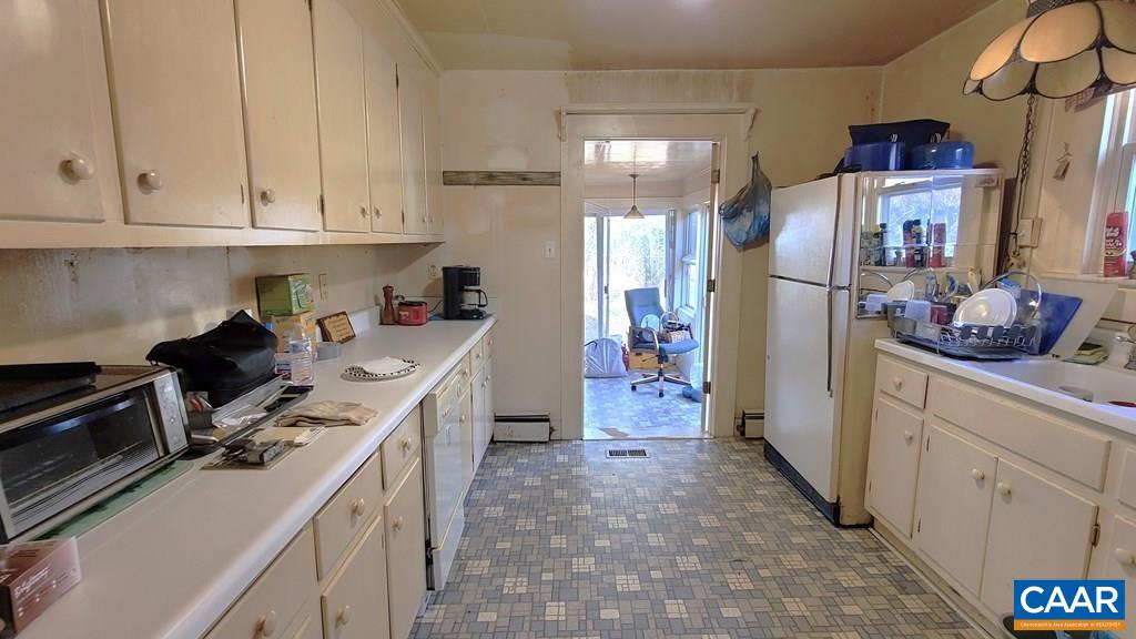 3689 Ranson Road Dillwyn, VA 23936 - Photo 19 of 51 a kitchen with refrigerator and cabinets