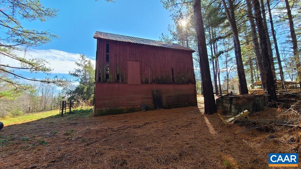 3689 Ranson Road Dillwyn, VA 23936 - Photo 4 of 51 a view of backyard with large tree and wooden fence