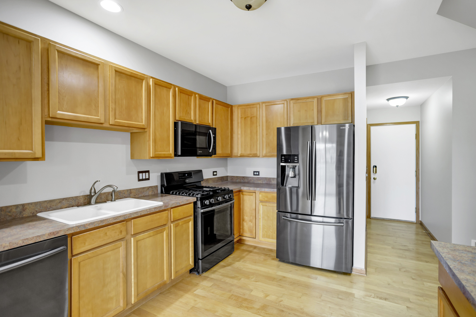 902 Oak Ridge Boulevard Elgin, IL 60120 - Photo 12 of 35 a kitchen with stainless steel appliances granite countertop a refrigerator stove top oven a sink and dishwasher