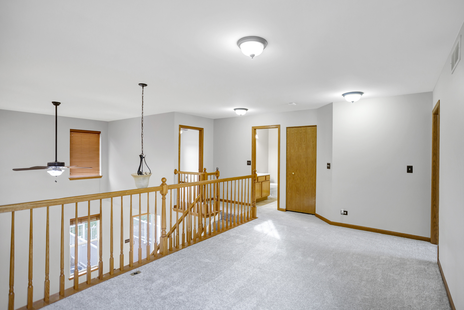 902 Oak Ridge Boulevard Elgin, IL 60120 - Photo 26 of 35 a view of a hallway with a chandelier