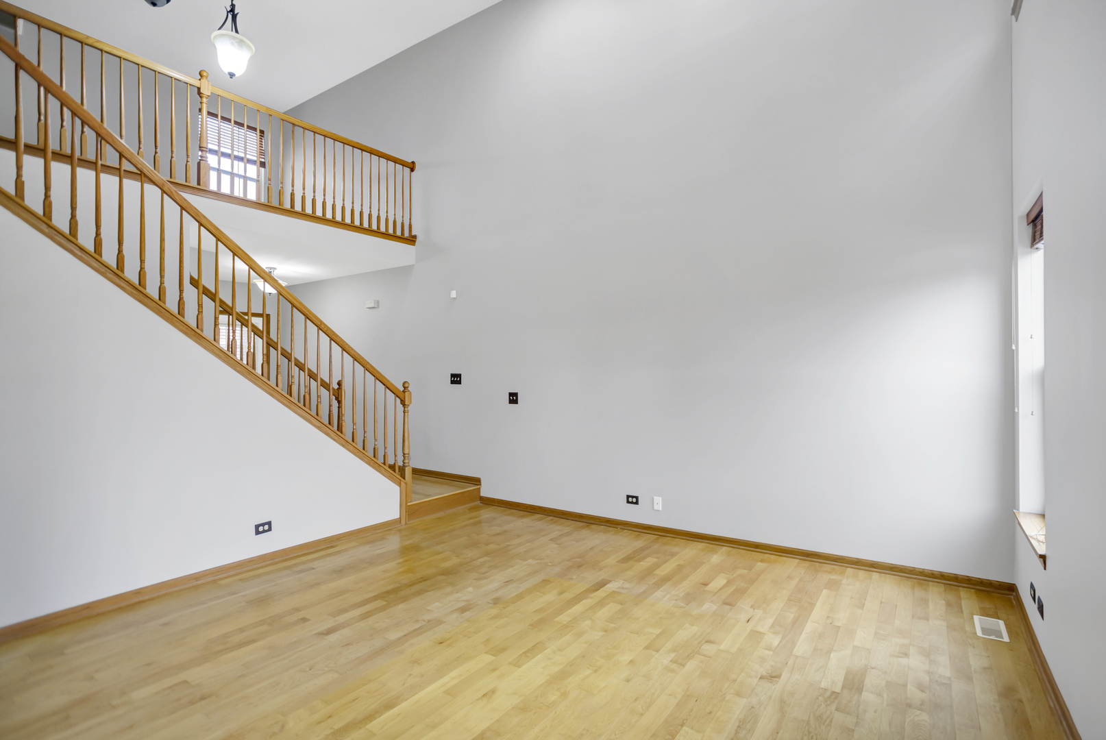 902 Oak Ridge Boulevard Elgin, IL 60120 - Photo 7 of 35 a view of an empty room with stairs