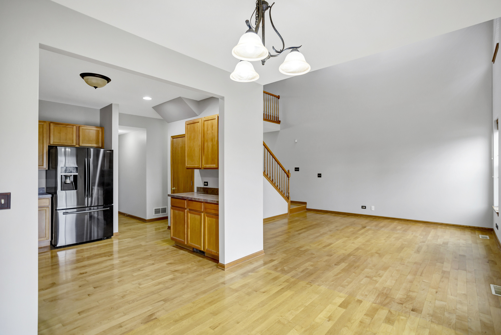 902 Oak Ridge Boulevard Elgin, IL 60120 - Photo 9 of 35 a view of a kitchen with a sink refrigerator and wooden floor