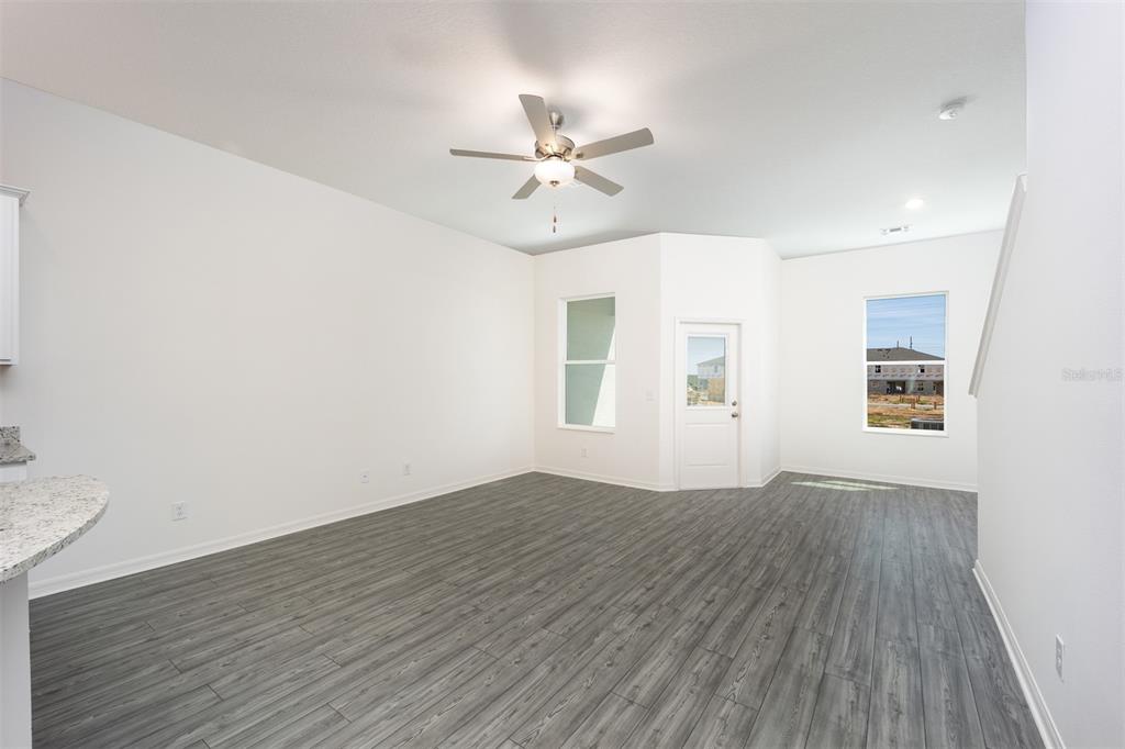 412 Sol Vista Drive Dundee, FL 33838 - Photo 8 of 16 wooden floor in an empty room with a window