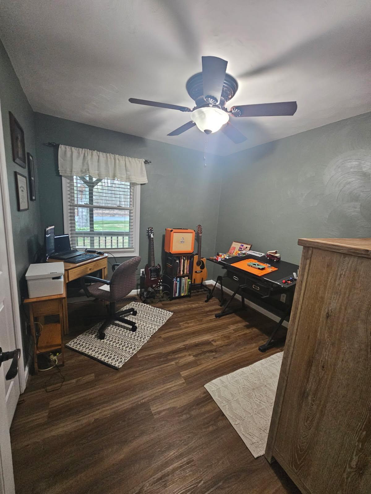 2768 Sandy Level Road Goodview, VA 24095 - Photo 26 of 56 a bedroom with a bed and a chandelier