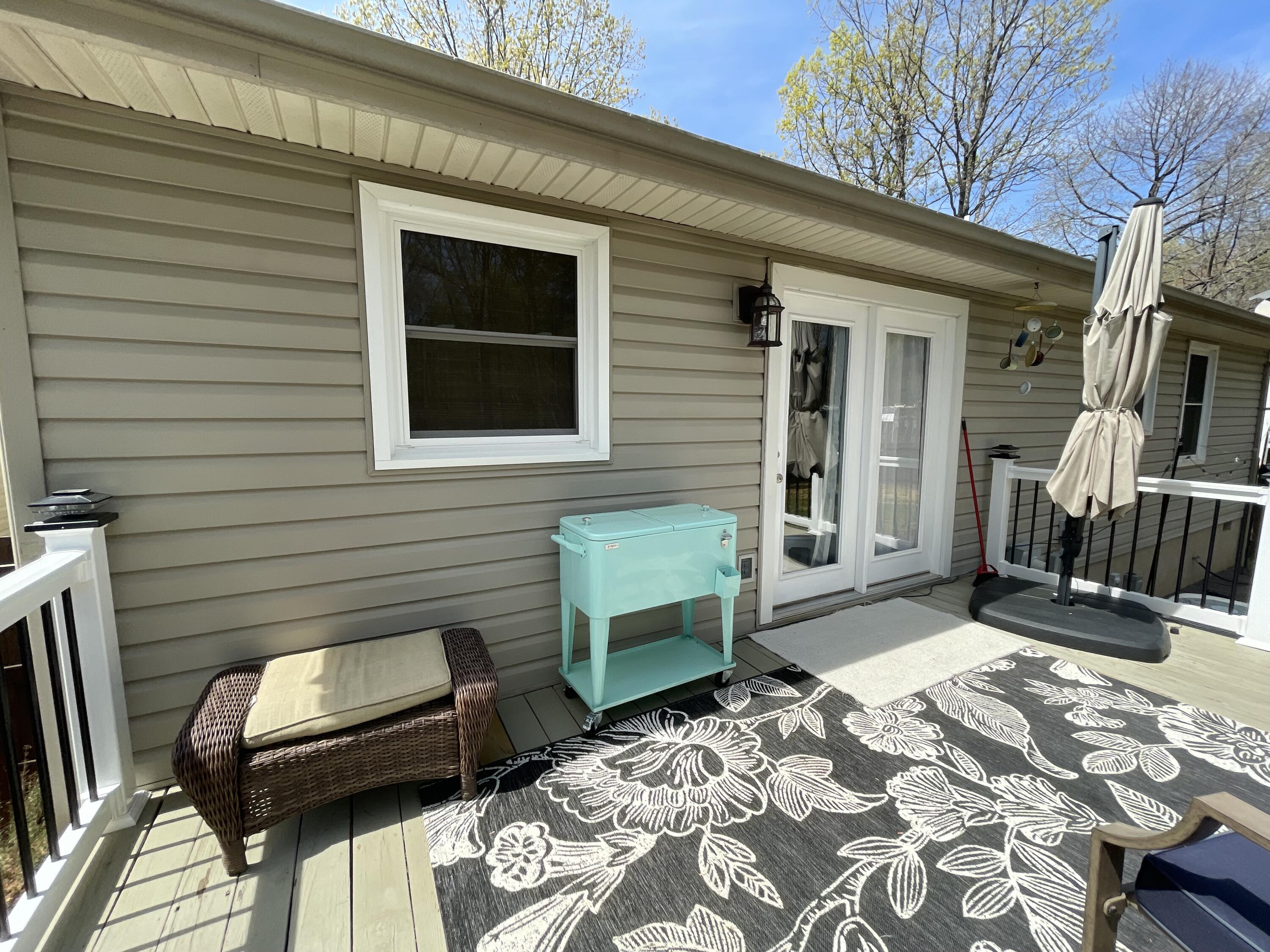 2768 Sandy Level Road Goodview, VA 24095 - Photo 42 of 56 a view of a backyard with a door and furniture