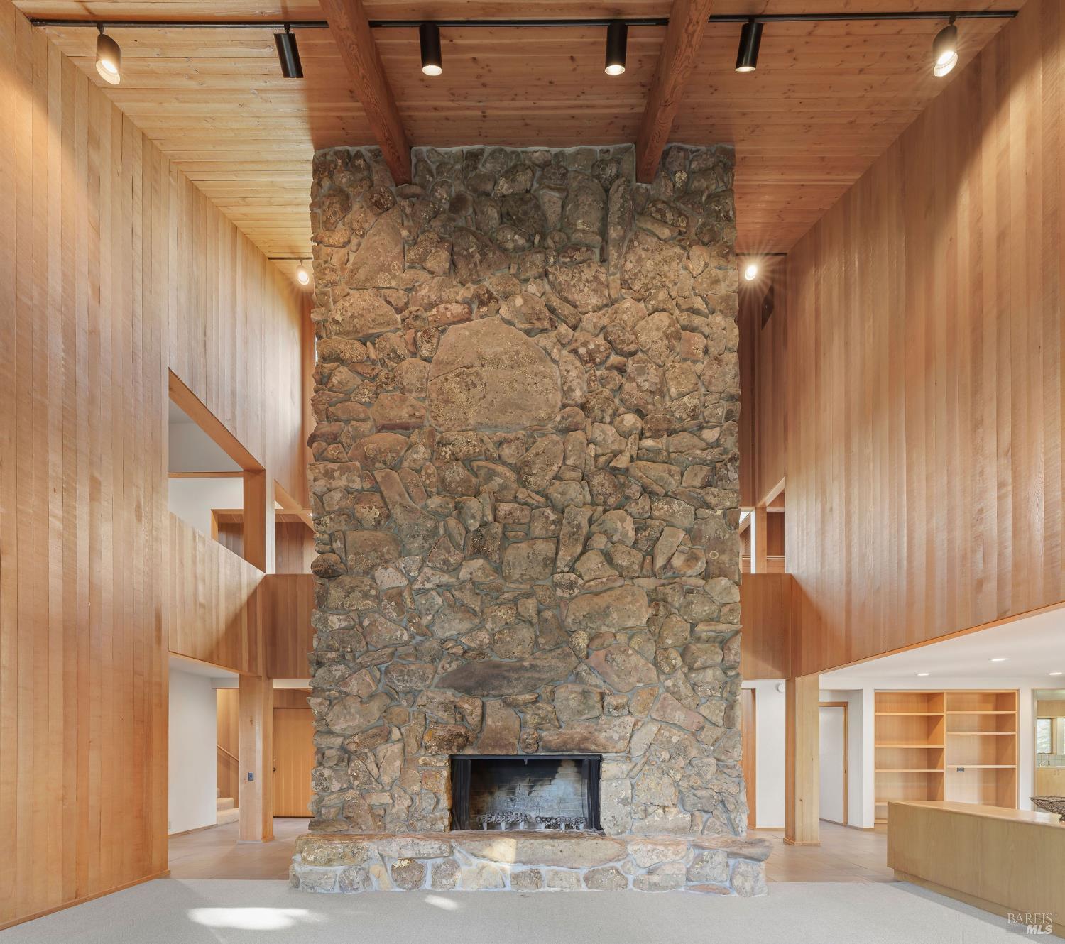 36029 Timber Ridge Road The Sea Ranch, CA 95497 - Photo 13 of 59 a front view of a building with a yellow lighting