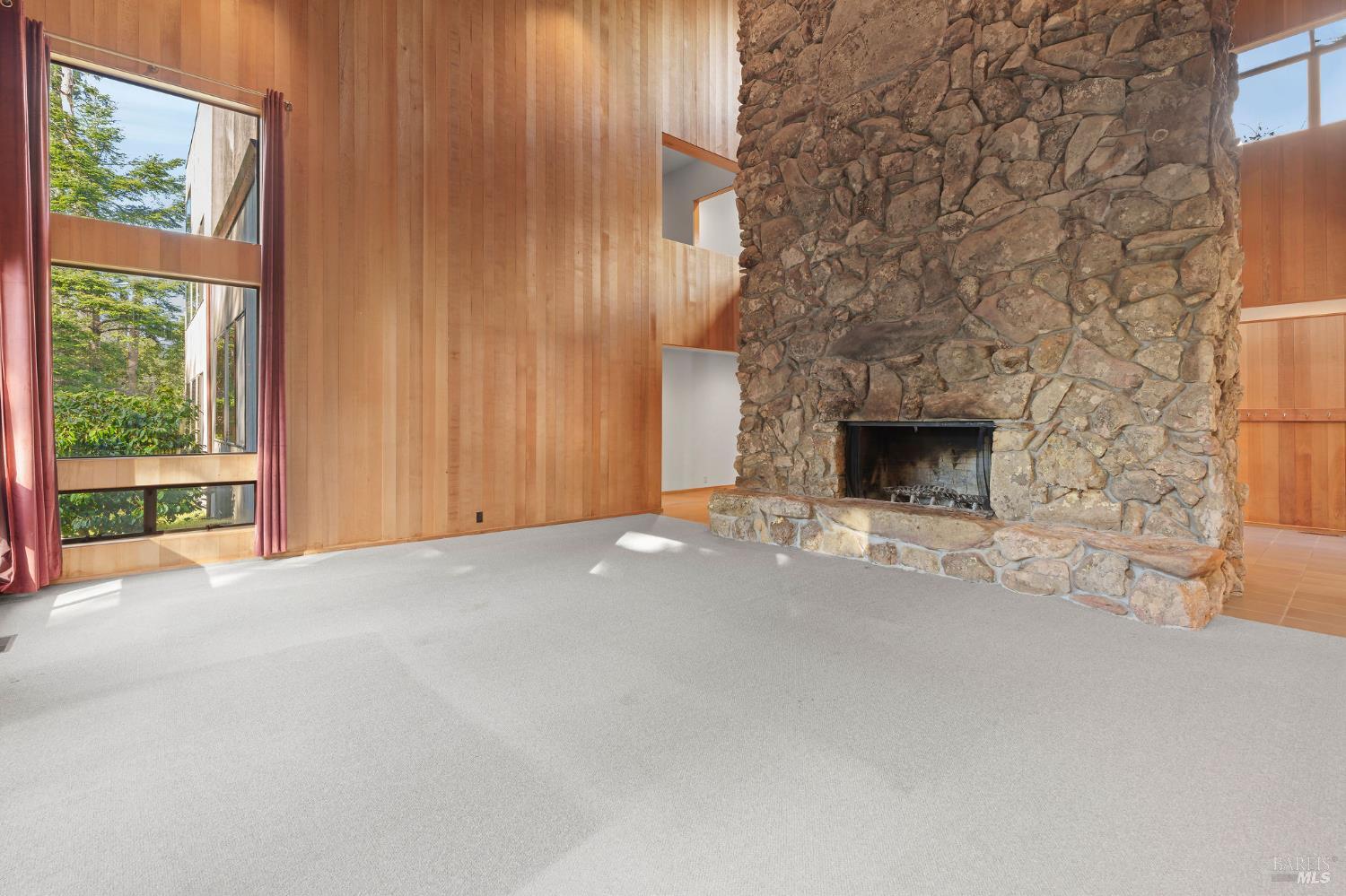 36029 Timber Ridge Road The Sea Ranch, CA 95497 - Photo 14 of 59 a view of empty room with fireplace and window