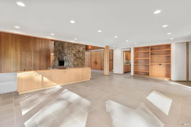 a view of an empty room with a window and outside view