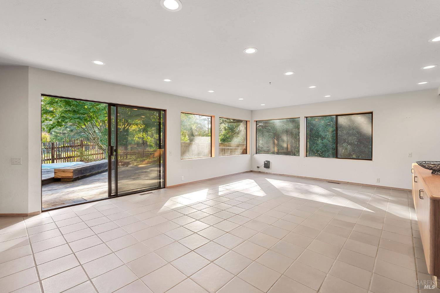 36029 Timber Ridge Road The Sea Ranch, CA 95497 - Photo 18 of 59 a view of an empty room with wooden floor and a window