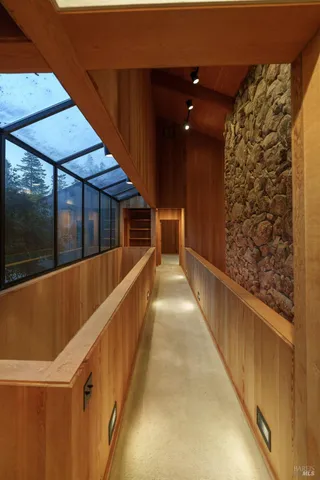 a spacious bedroom with a large bed and a large window