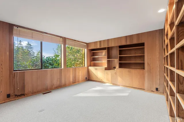 a bathroom with a granite countertop sink and a large mirror