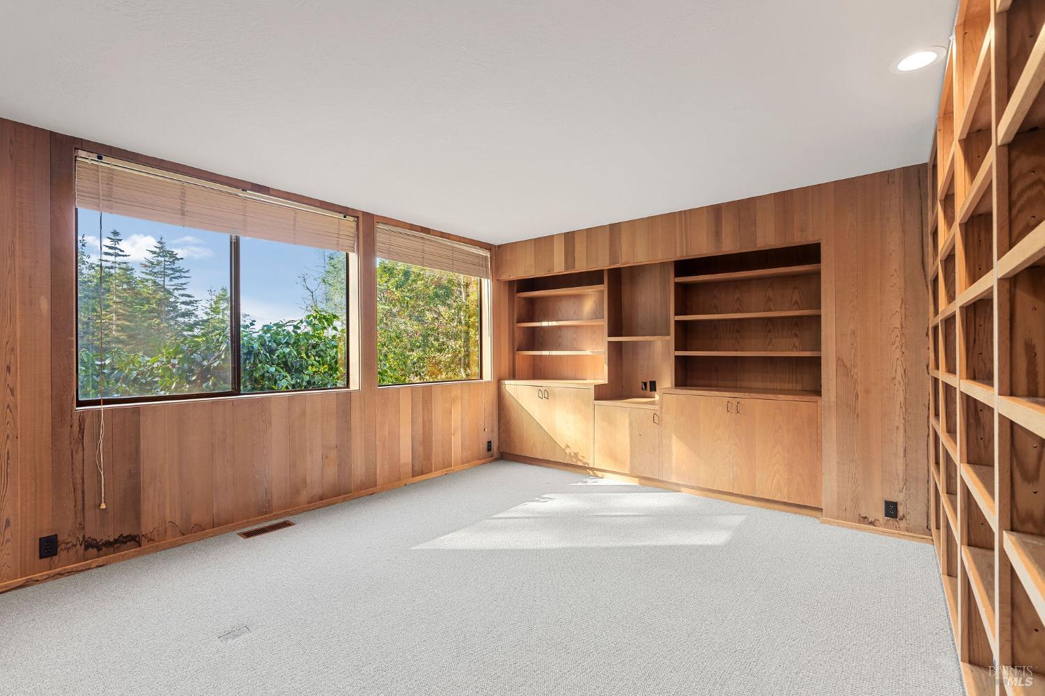36029 Timber Ridge Road The Sea Ranch, CA 95497 - Photo 25 of 59 wooden floor in an empty room with a window