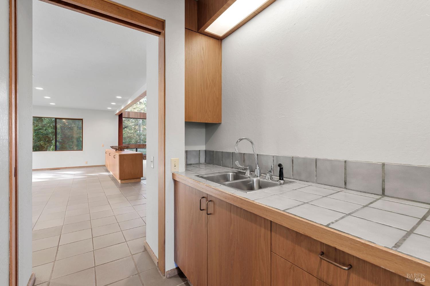 36029 Timber Ridge Road The Sea Ranch, CA 95497 - Photo 33 of 59 a kitchen with a sink and a refrigerator